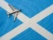 avion posée sur le drapeau écossais